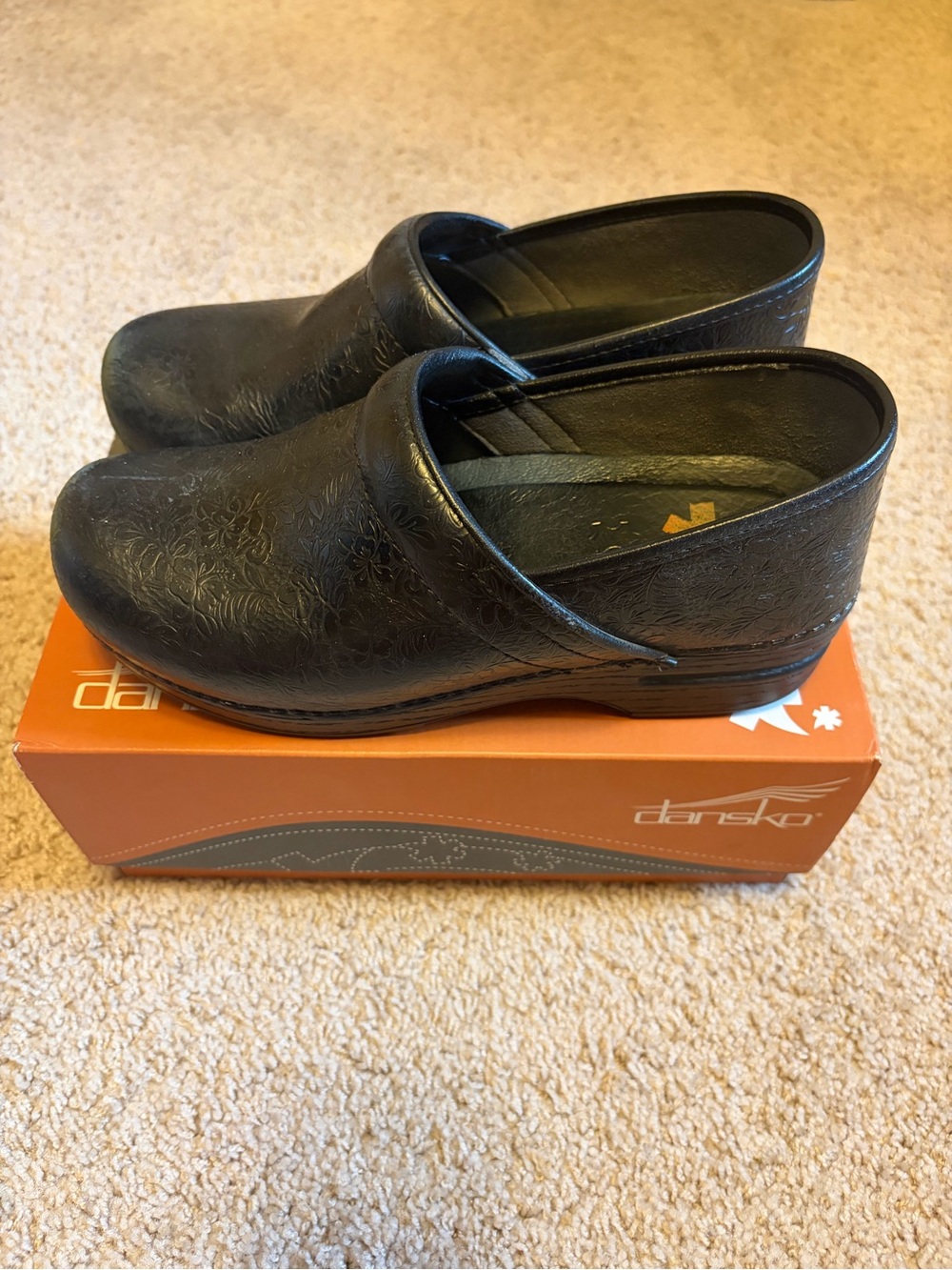 Dansko Black Embossed Leather Slip-On Clogs